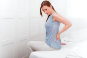 after sleep hurting back person